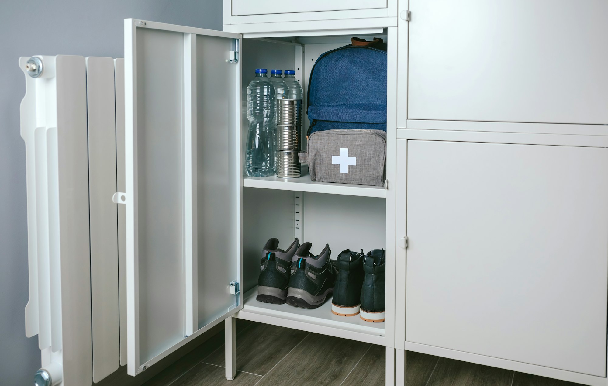 Emergency backpack and first aid kit kept in a closet